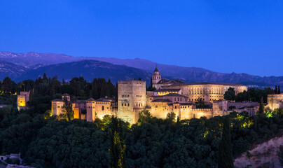 Fototapeta na wymiar Panorama view of the Alhambra Palace on the hill top in the blue hour time, Granada Spain