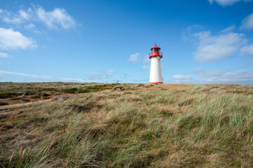 Fototapeta na wymiar Lighthouse List West along the North Sea coast, Sylt, Schleswig-Holstein, Germany