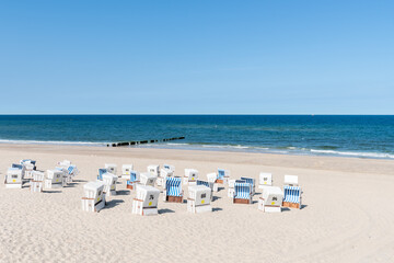 Fototapeta na wymiar Beach chairs at the Weststrand (West beach) on the North Sea coast, Sylt, Schleswig-Holstein, Germany