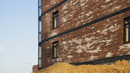A new brick house stained with white efflorescence, a crystalline of salt, formed due to water...