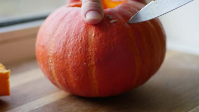 Pumpkin carving 4k video. Halloween decoration prepare. Autumn holidays craft 