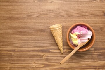 fruit ice cream in a bowl on wooden table