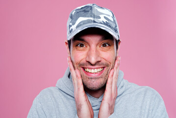 Excited young man receiving winning news , celebrating and feeling victorious