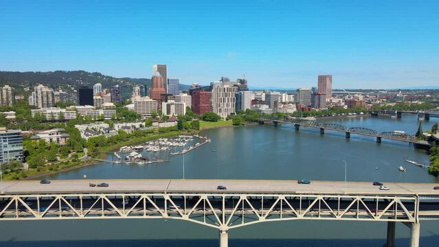 Aerial Drone Video of the Portland, Oregon skyline, a cityscape drone panorama of PDX with bridges and cars crossing the Willamette River