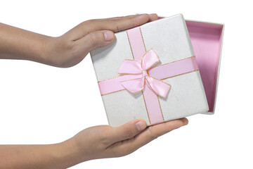 woman's hands opening giftbox with white lid and pink bow on isolated white background with empty space