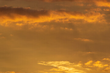 orange sky with clouds.