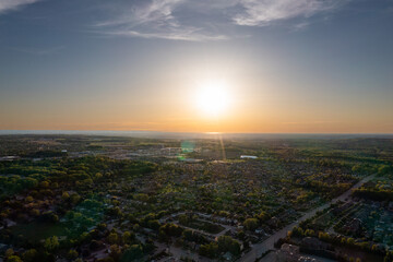 Barrie suburbs sunset drone view  sun shining 