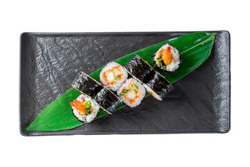 sushi shrimp roll on black plate isolated on white top view