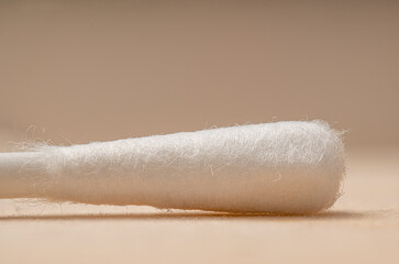 Fototapeta na wymiar Cotton swab with absorbent wool buds stick isolated on the extreme Macro