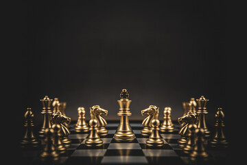 Fototapeta King chess stand on chessboard concepts of teamwork volunteer challenge business team or wining and leadership strategy or strategic planning and risk management or team player. obraz