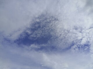Cloudscape with blue sky and white clouds