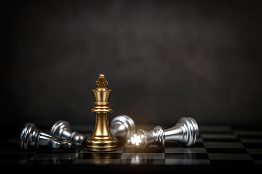Close up king chess stand with falling chess concept of team player or business team and leadership strategy or strategic planning and human resources organization risk management.