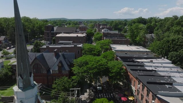 Flying Backwards Shot Of Main Street In Beacon NY Revealing Church