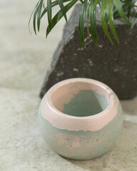 Plaster candlestick, decor interior. Handmade pots made for plants. Gypsum, concrete products.