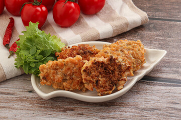 Fried salmonn cutlet in the bowl