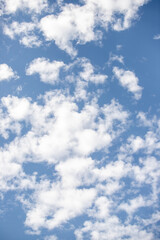 Blue sky background with white clouds.