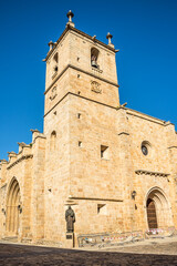 Fototapeta premium View at the Bell tower of Santa Maria Cathedral in the streets of Caceres - Spain