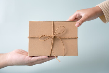 Sending and receiving gift with ribbon bow for special occation to someone you love. Holidays...