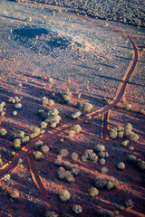 Portrait - Ariel view of dirt road in aboriginal country, Northern Territory Australia, creating natural artwork.