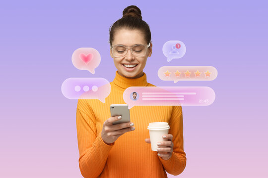 Pretty female blogger checking social media notifications holding phone and plastic cup of coffee