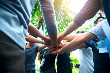 Fototapeta na wymiar Teamwork Hands of spirit team working together outdoor. Unity strong handshake with people or agreement of feeling or happy diverse education action