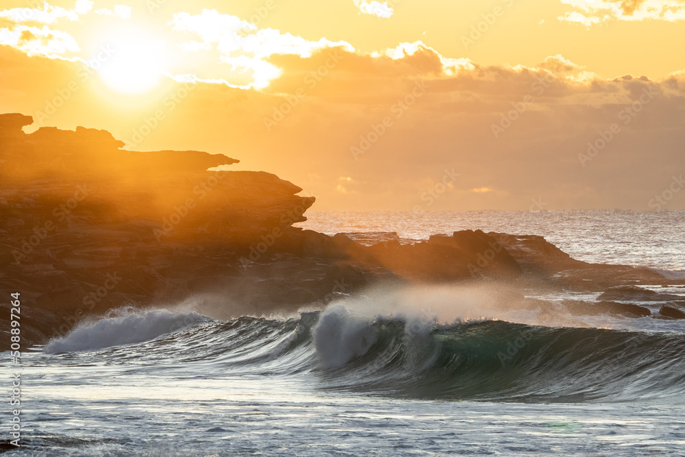 Poster waves crashing on the beach at sunset