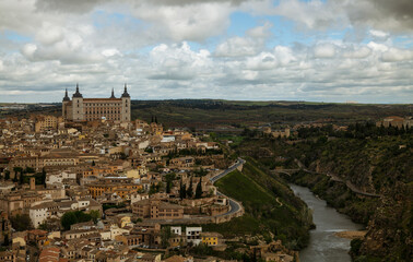 Fototapeta na wymiar City skyline of Toledo, Spain, against cloudy sky