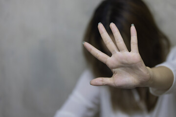Girl hand is stopping harassment on the bedroom. stop violence against Women, international women's day. - obrazy, fototapety, plakaty