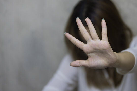 Girl hand is stopping harassment on the bedroom. stop violence against Women, international women's day.