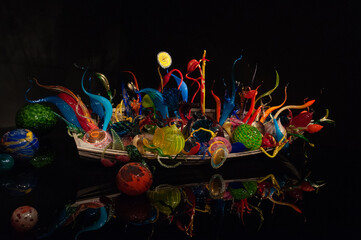 A boat in the dark full of Colorful glass balls and abstract creations at the Seattle Center, Seattle, USA