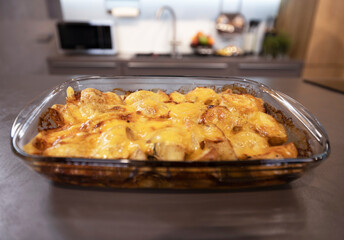 Appetizing French baked potatoes with soft cheese