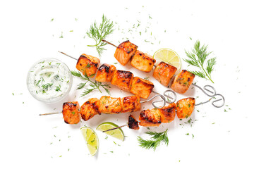 Grilled salmon skewers with  cheese sauce and greens. Isolated on white background. Top view - 508904891