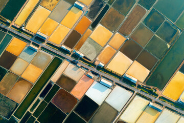 Aerial view Beautiful colorful salt fields in the evening, Ban Laem, Phetchaburi Province, Thailand.