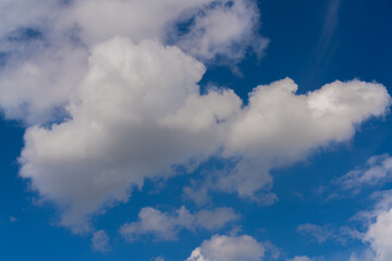Beautiful white clouds on a bright blue background.