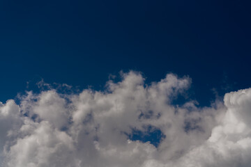 Beautiful white clouds on a bright blue background.