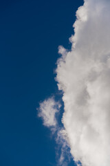 Fototapeta na wymiar Beautiful white clouds on a bright blue background.