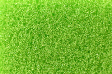 Macro of a bright green sponge, abstract background