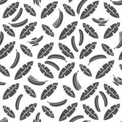 Seamless pattern with black and white palm leaves and bananas. Tropical vector background with isolated objects on white background.