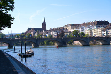 Skyline of the old town of Basel with famous Basler Münster (Basler Minster) and Middle Rhine Bridge on a sunny spring day. Photo taken May 11th, 2022, Basel, Switzerland.