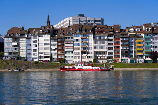 Colorful facades of historic houses at border of Rhine River on a sunny spring day. Photo taken May 11th, 2022, Basel, Switzerland.