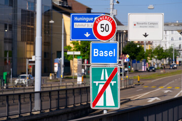 Traffic signs at end of highway at City of Basel on a sunny spring day. Photo taken May 11th, 2022, Basel, Switzerland.