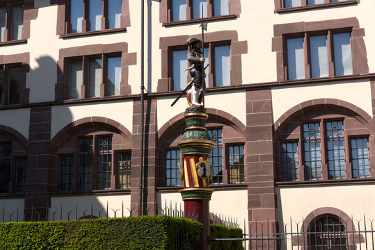 Statue of medieval soldier at fountain at the old town of City of Basel on a sunny spring day. Photo taken May 11th, 2022, Basel, Switzerland.