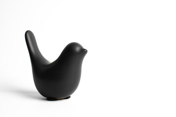 Black ceramic bird on white