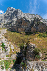 mountain scenery with a curving path on the Cares hiking route in Asturias