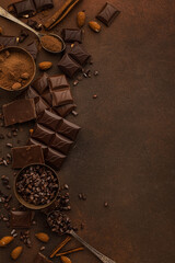 Chocolate variety on brown background copy space
