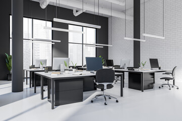 Coworking interior with pc computer and armchair, panoramic window on city view