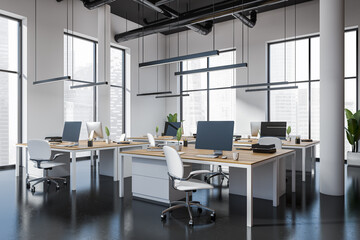 Office interior with computer, table and panoramic window on city view