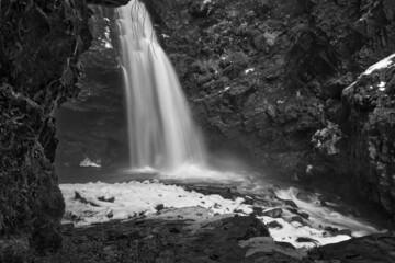 beautiful waterfall in the mountains, long exposure photo of water fall at winter concept idea low angle photo.