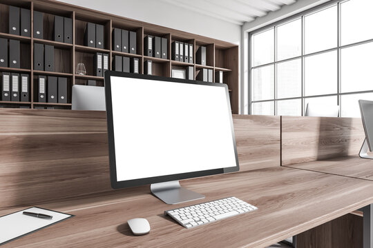 Business interior with pc desktop, panoramic window and mockup display