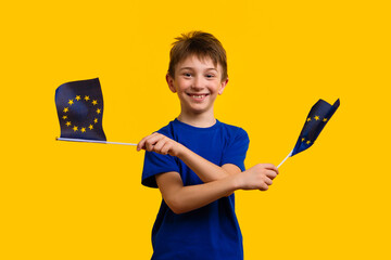 Schoolboy Waving Two European Union Flags